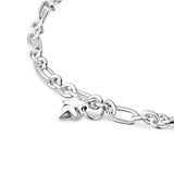 A silver oval link bracelet with a small charm in the shape of a heart.