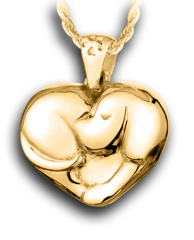 A gold pendant showing a sleeping puppy curled up in the shape  heart and a tiny paw print on the bail for the chain.
