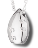 A silver tear drop shaped pendant with tiny paw prints along the front.
